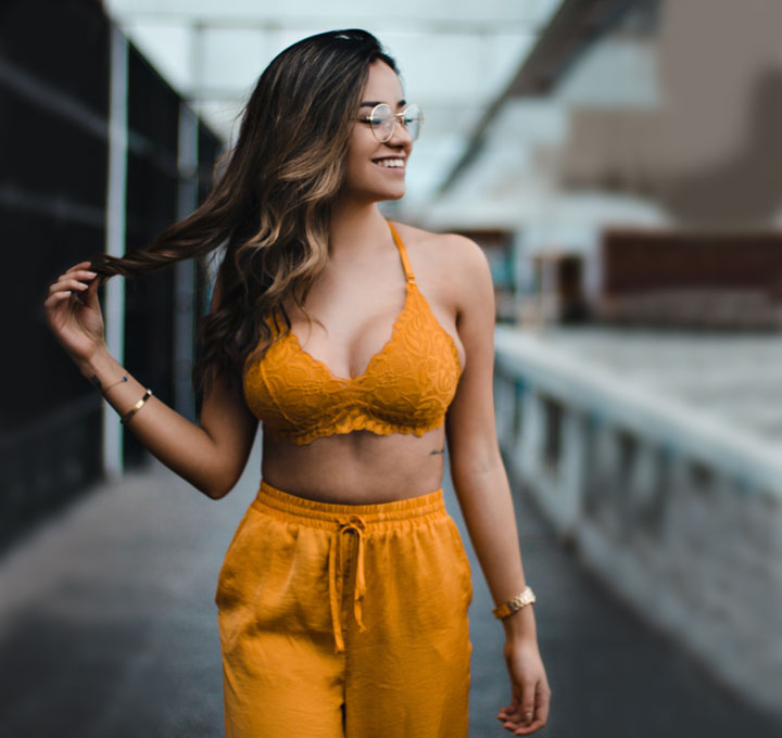 smiling latin girl in yellow top